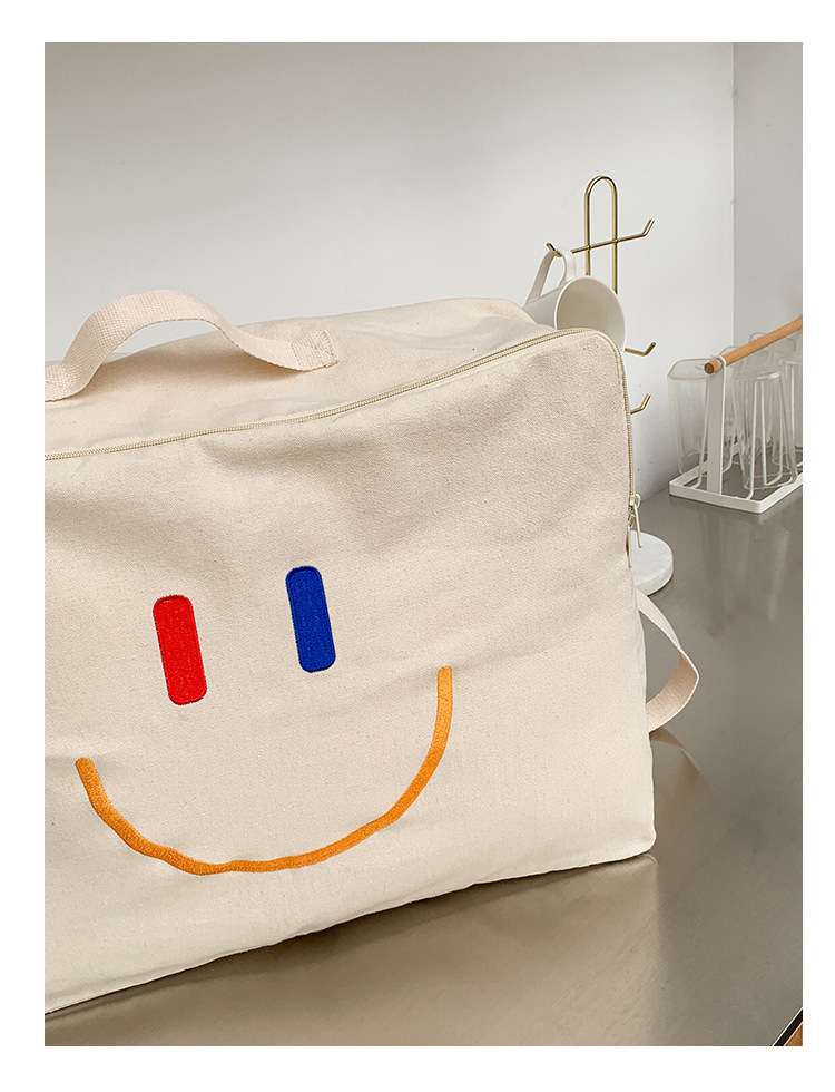 ボストンバッグ にこにこ顔のダッフルバッグ